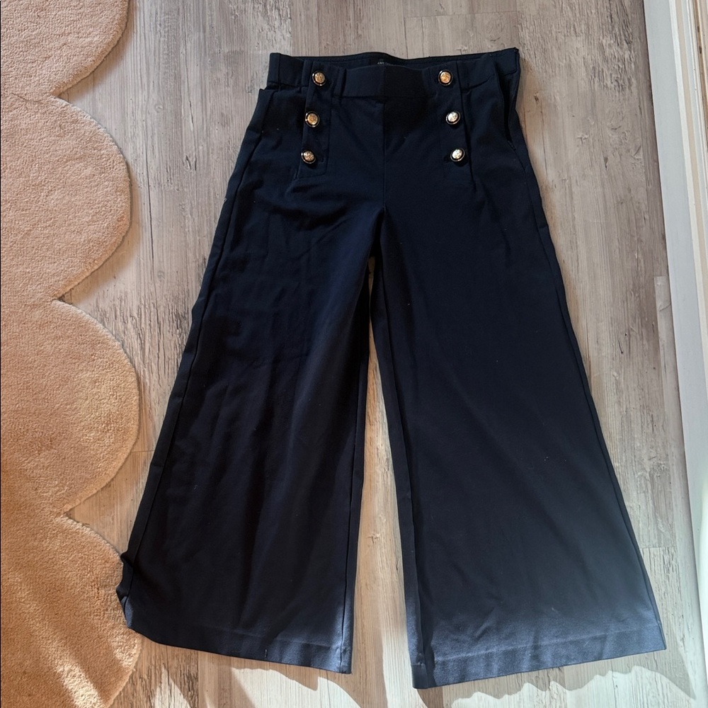 Women stretchy high rise navy pants with gold button detail